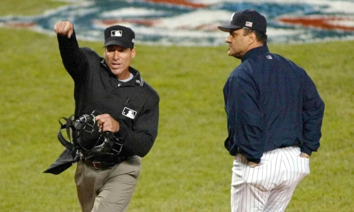 Ex-Yankees manager Joe Torre and umpire Angel Hernandez