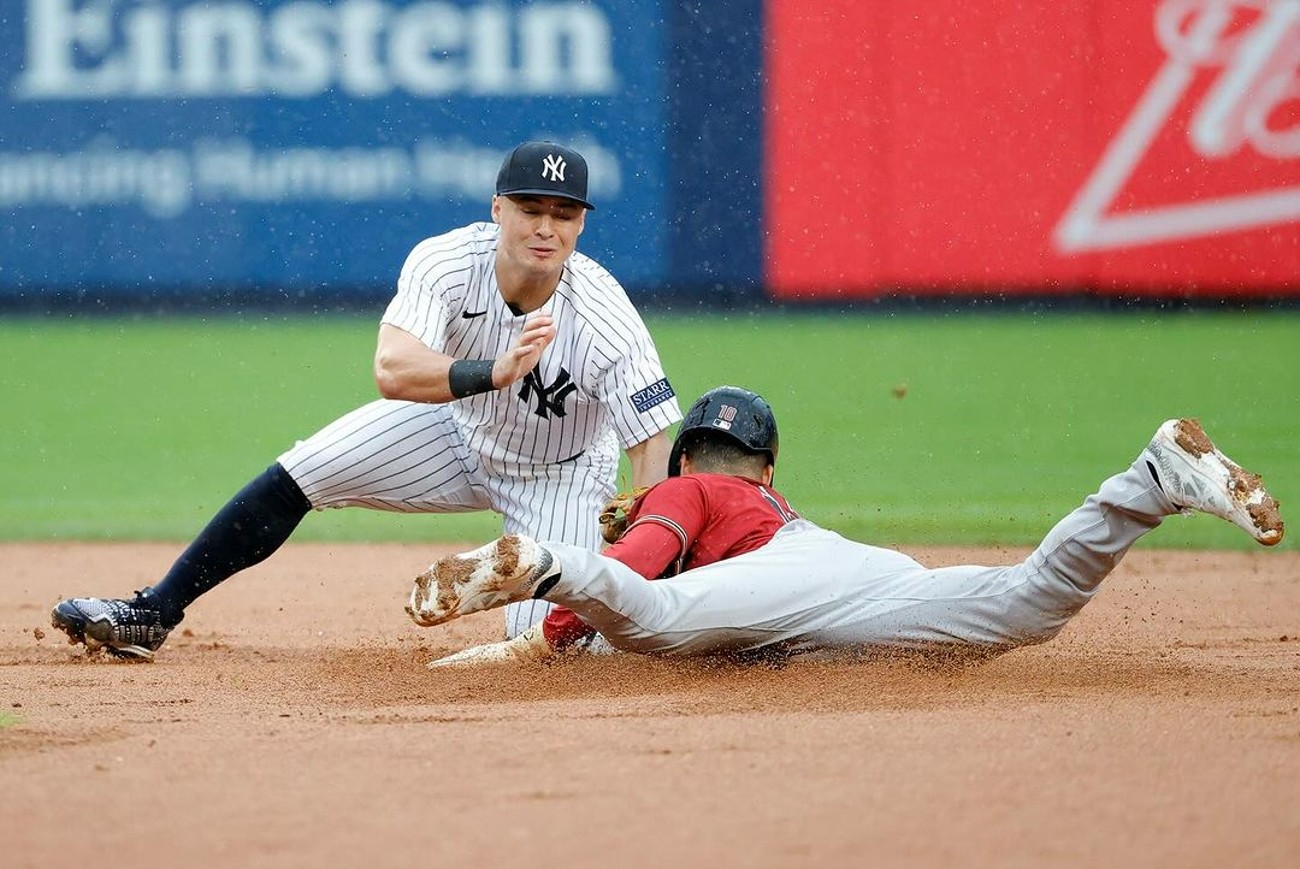 Yankees shortstop Anthony Volpe tags out Arizona shortstop Jordan Lawlar at Yankee Stadium on September 24, 2023.