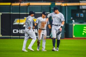 Yankees' Aaron Judge, Jasson Dominguez, and Everson Pereira celebrate after beating the Astros 5-4 on September 2, 023, in Houston.