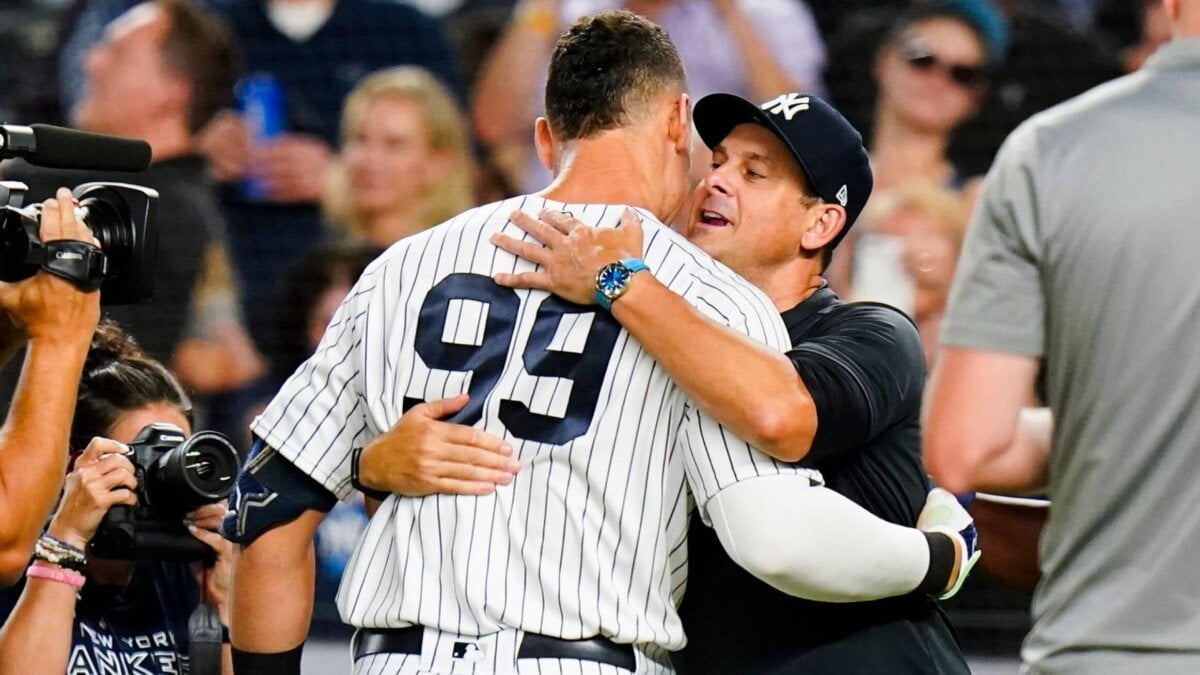 Aaron Bone hugs Aaron Judge at Yankee Stadium after his three-homer game on Sept 22, 2023.