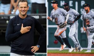 Aaron Boone and Yankees players celebrate after winning the doubleheader in Boston on Sept. 12, 2023.