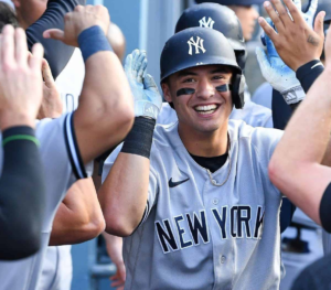 Anthony Volpe celebrates with Yankees teammates after he scored a three-run HR vs. the Tigers at Comerica Park on Aug 31, 2023.