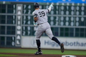 Yankees captain Aaron Judge celebrates after hitting a home run against the Astros in Houston on 