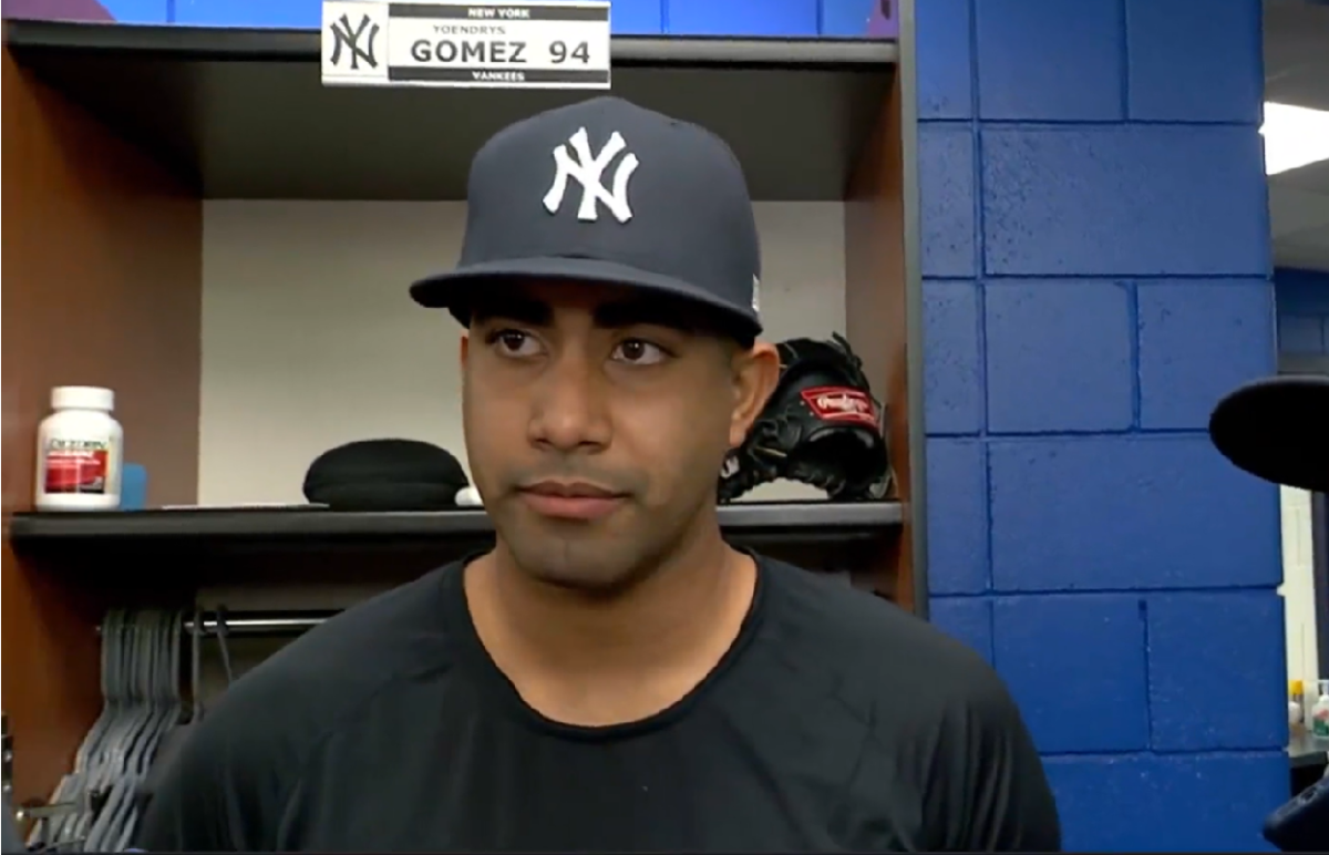 Yankees prospect Yoendrys Gomez is talking to reporters after he made a shining debut against the Blue Jays on Sept. 28, 2023, at Rogers Center.