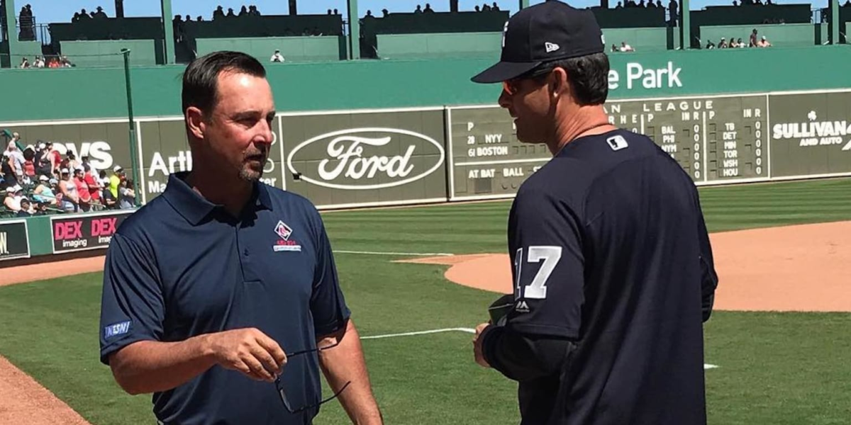 Tim Wakefield is with Aaron Boone in 2018.