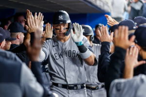 Yankees Aaron Judge celebrates in dugout after his two-homer game against the game against the Blue Jays in Toronto on Sept. 27, 2023.