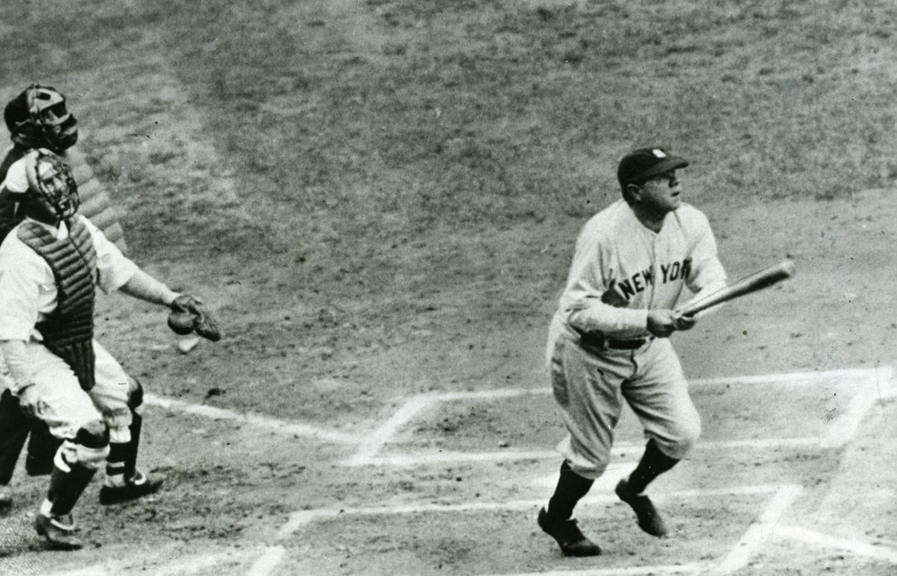Babe Ruth coming to home plate after hitting a home run in game