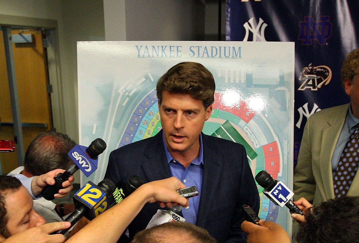 Yankees owner Hal Steinbrenner is talking to reporters 
