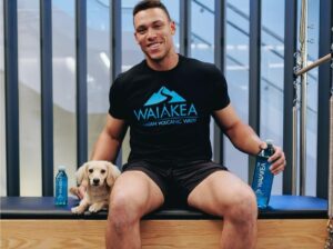 Aaron Judge and his dog Penny are in a Waiakea promotion in 2022.