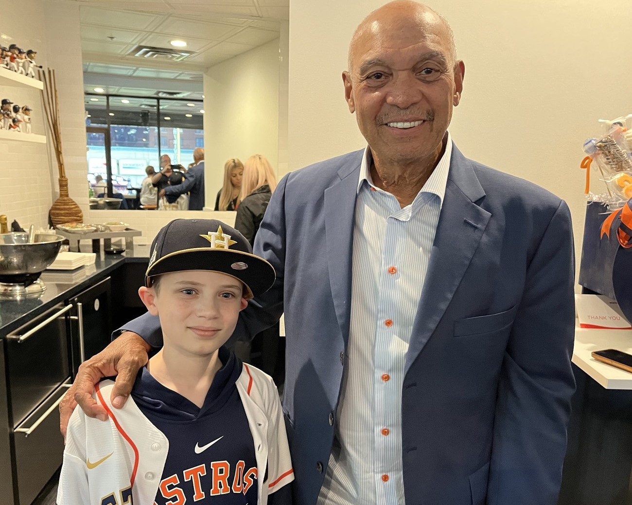 Ex-Yankees great Reggie Jackson with a young Houston Astros fan.