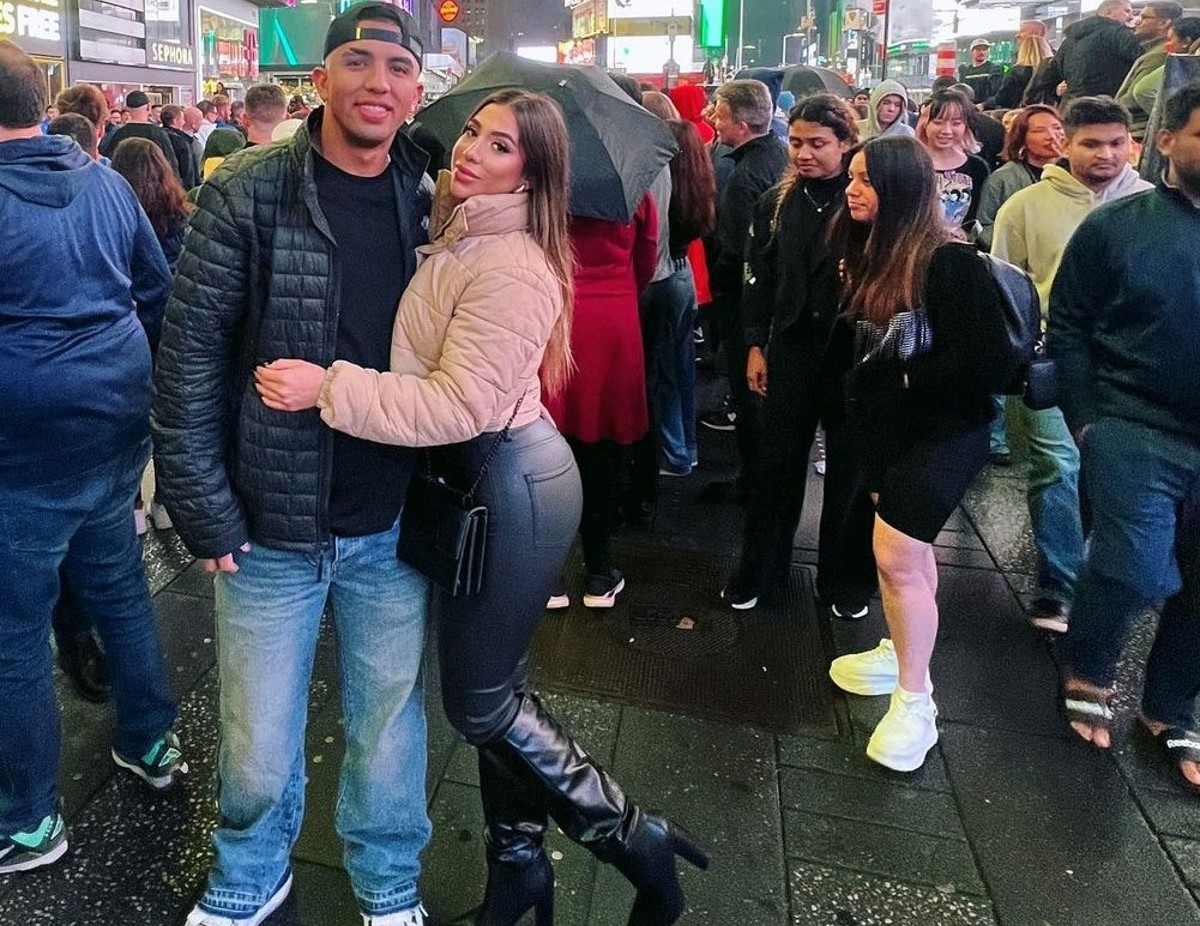 Yankees' Oswald Peraza is with his wife at Times Square, New York.