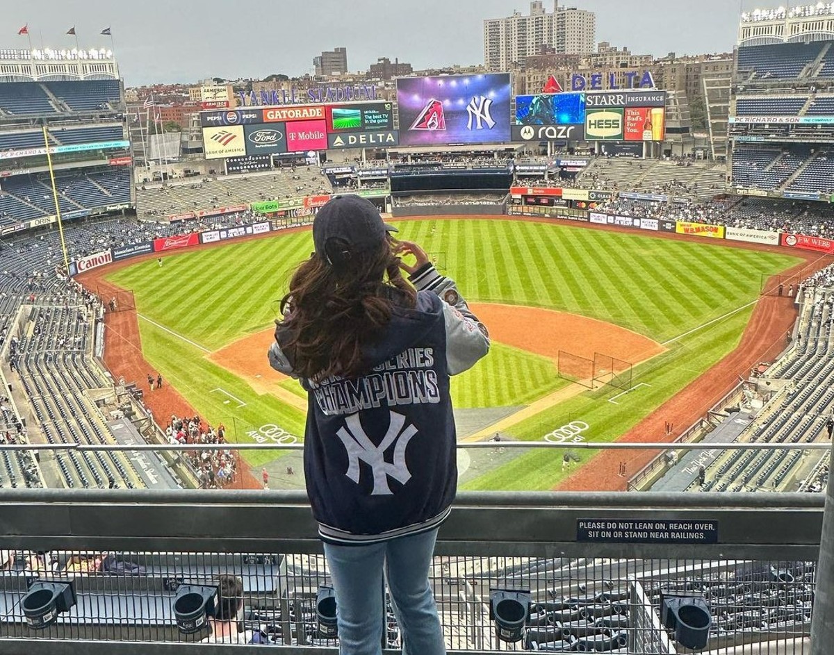 A Yankees fan looking at the Yankee Stadium prior to the start of a game.