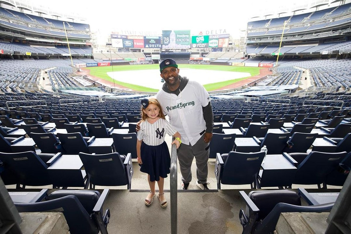 CC Sabathia is with a young fan while hosting Poland Spring’s batting practice at Yankee Stadium in Sept. 21, 2023.