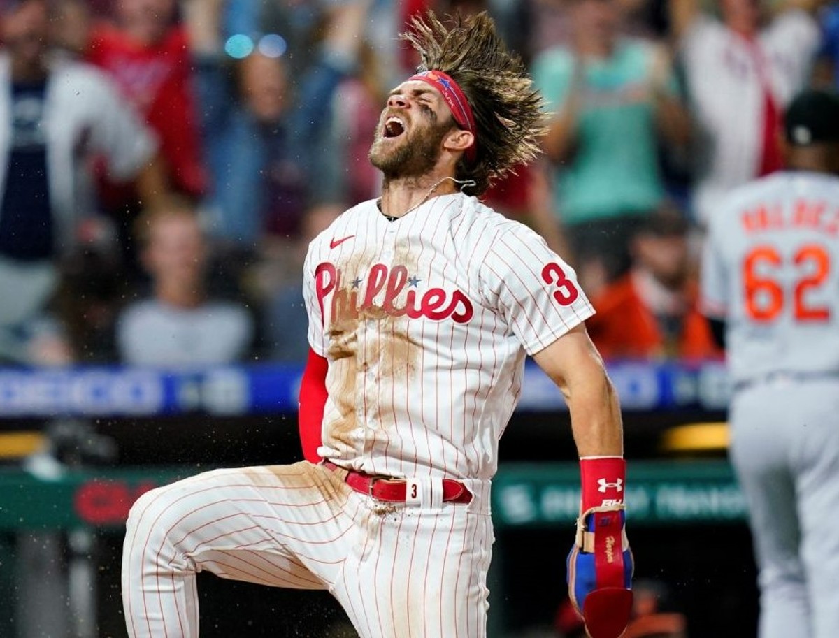 Bryce Harper celebrates after scoring a home run against the Braves on Oct 11, 2023.