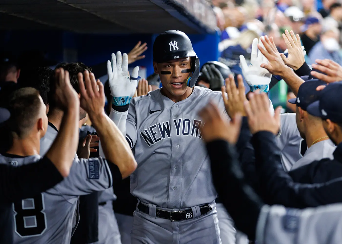 Aaron Judge #99 of the New York Yankees celebrates a two-run home run in the fourth inning against the Toronto Blue Jays at Rogers Centre on September 27, 2023 in Toronto, Canada.