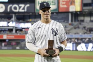 Yankees star Aaron Judge holding a trophy