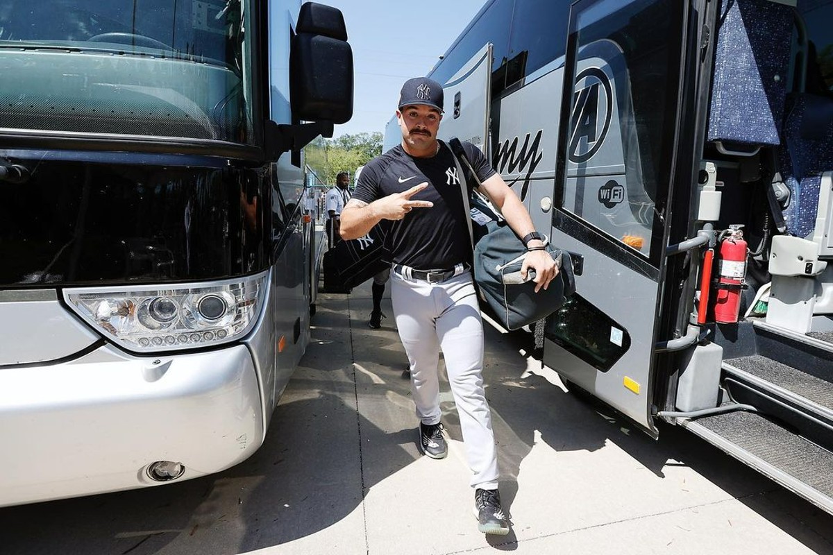 Yankees catcher Austin Wells alights from a bus at Tampa training Complex in 2023.