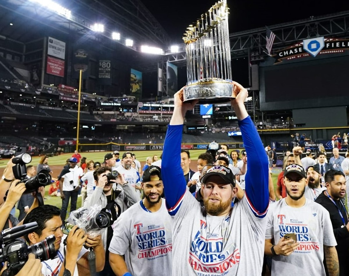 Ex-Yankees pitcher Jordan Montgomery with the 2023 World Series trophy won by the Texas Rangers