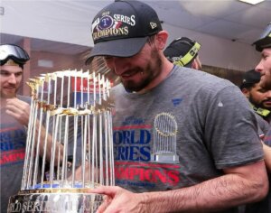 Rangers' pitcher Andrew Heaney, who played for the Yankees in 2021, is with the 2023 World Series trophy on November 1, 2023, in Phoenix, Arizona.