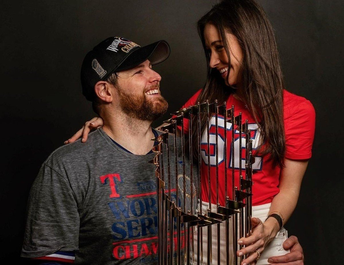 Jordan Montgomery and wife McKenzie Dirr with the 2023 World Series trophy.