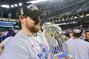 Ex-Yankees Jordan Montgomery is with the World Series Trophy after winning it with the Rangers in 2023.