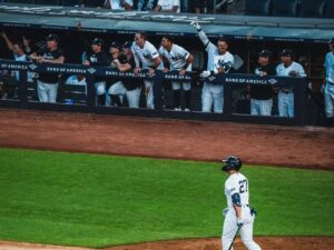 Yankees in the dugout reacts following a home run by Giancarlo Stanton at Yankee Stadium