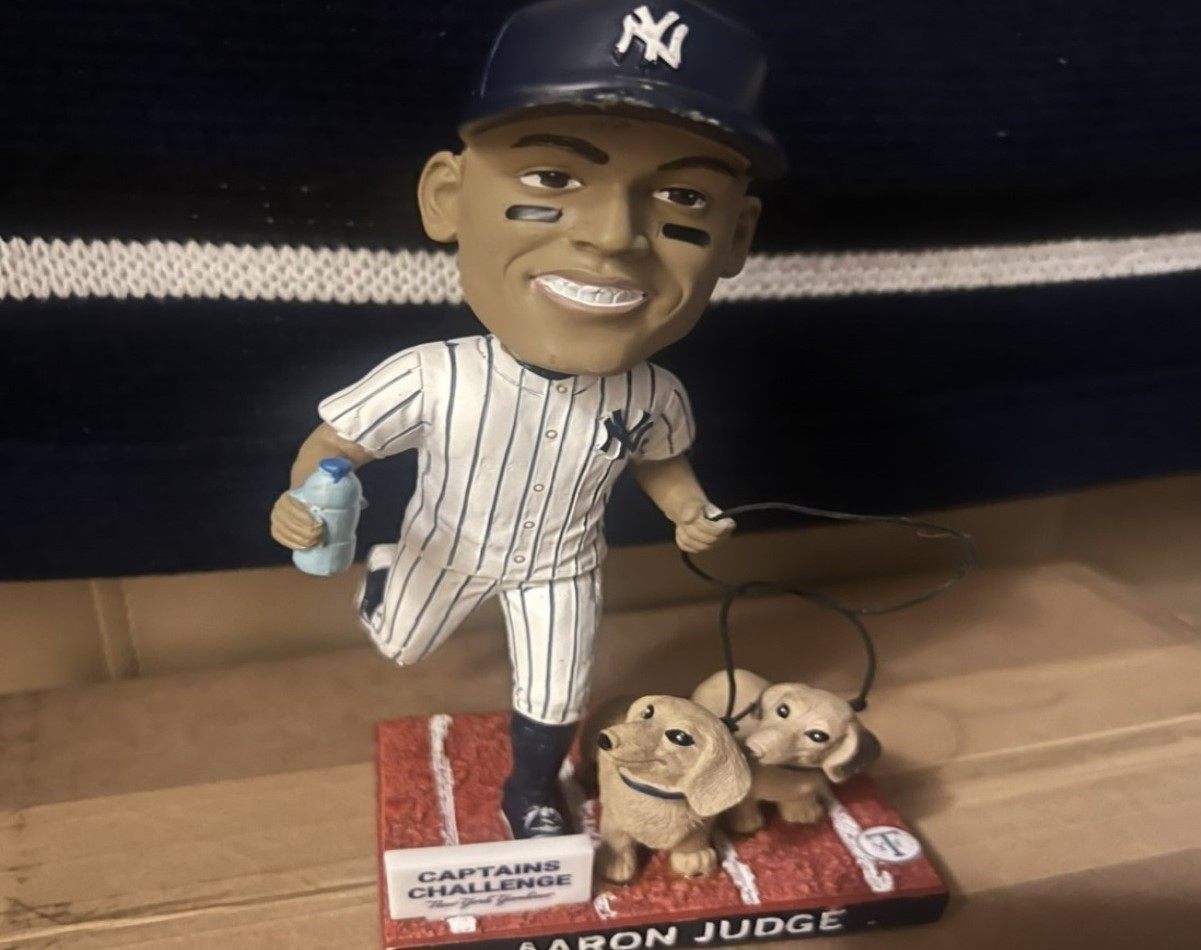 A miniature replica of Aaron Judge, the Yankees captain, with his dogs.