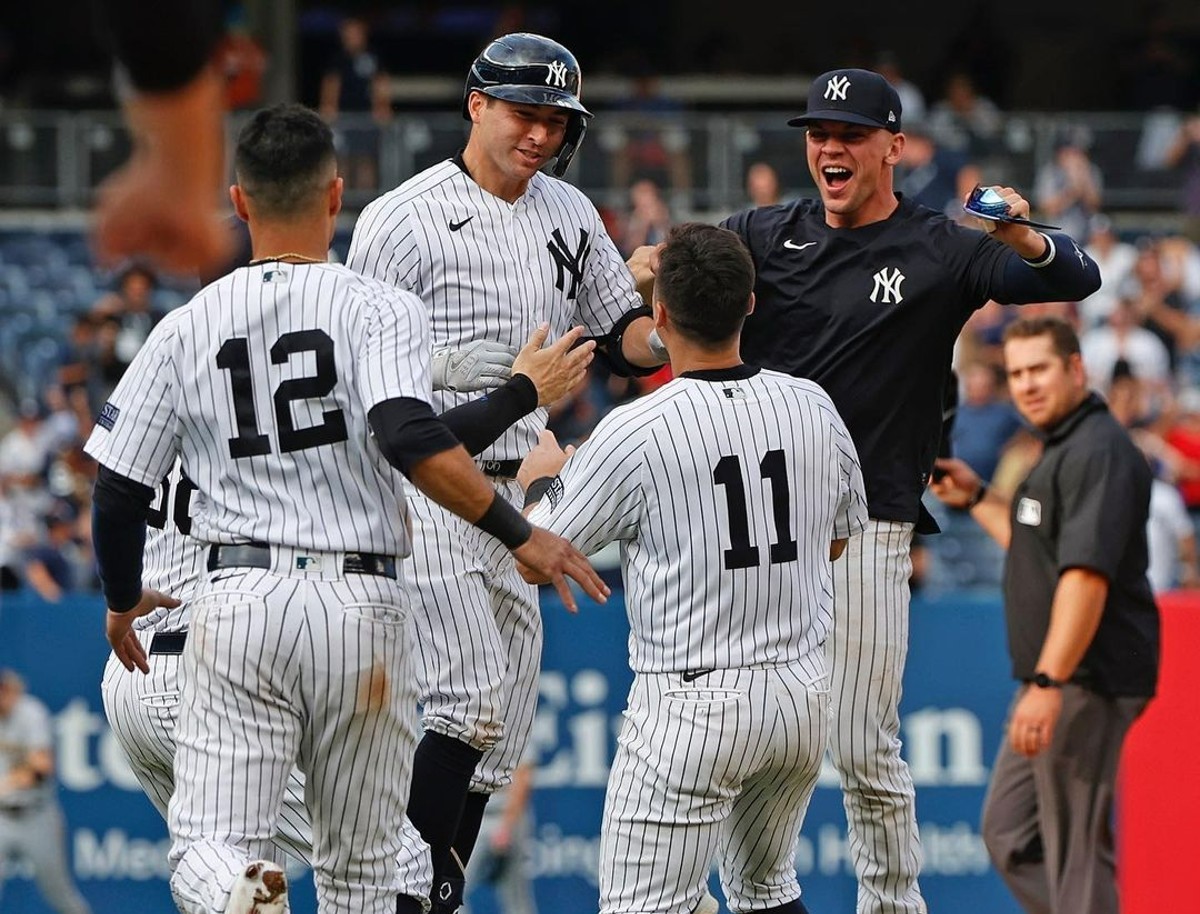 Kyle Higashioka celebrates with teammates after his walk-off double helped the Yankees win 4-3 against the Brewers in 13 innings on Sept 10, 2023, at Yankee Stadium.