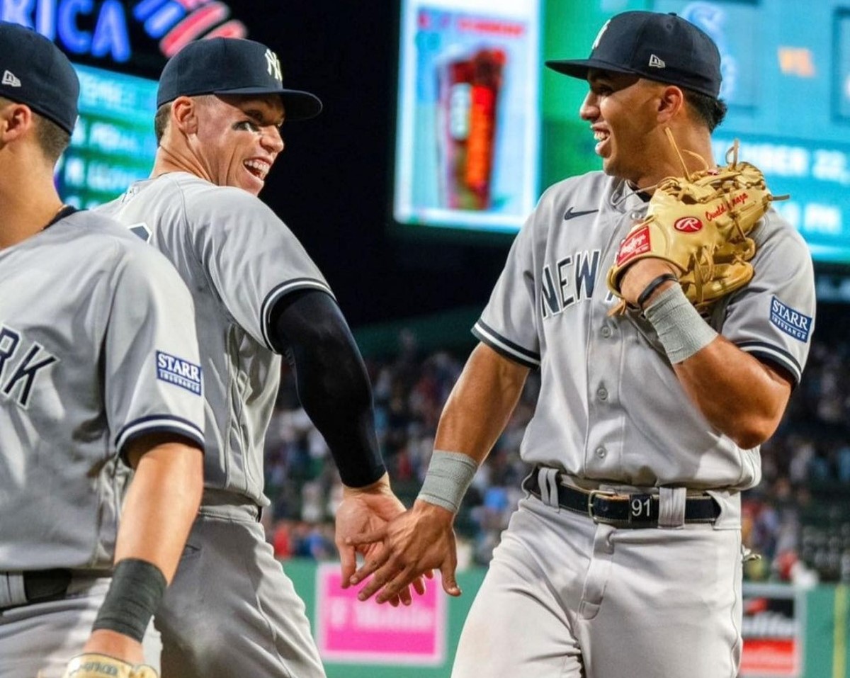 Aaron Judge and Oswald Peraza celebrates after the Yankees beat the Astros in Houston in