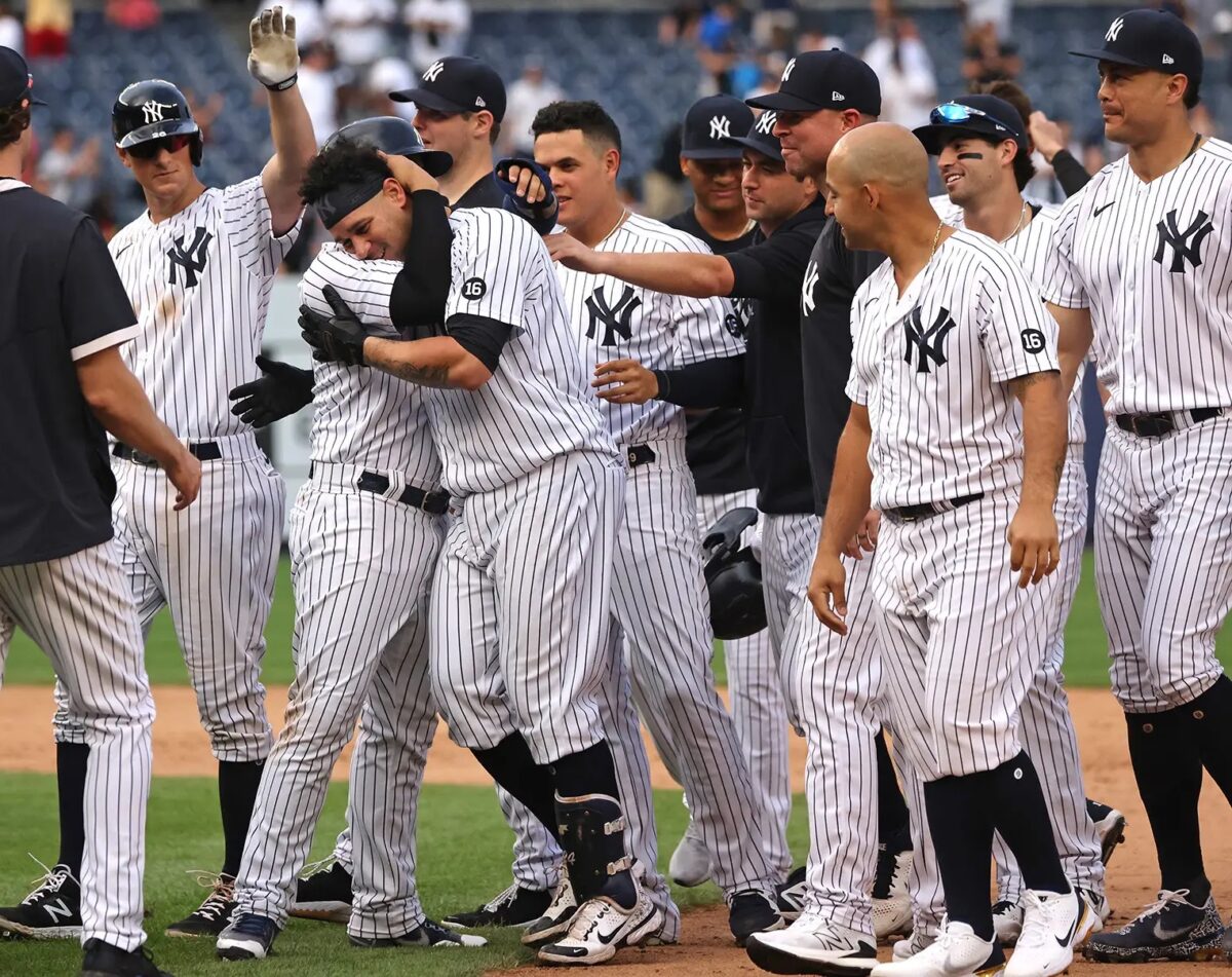 The 2021 New York Yankees celebrate after beating the Twins on Sept 13, 2021.