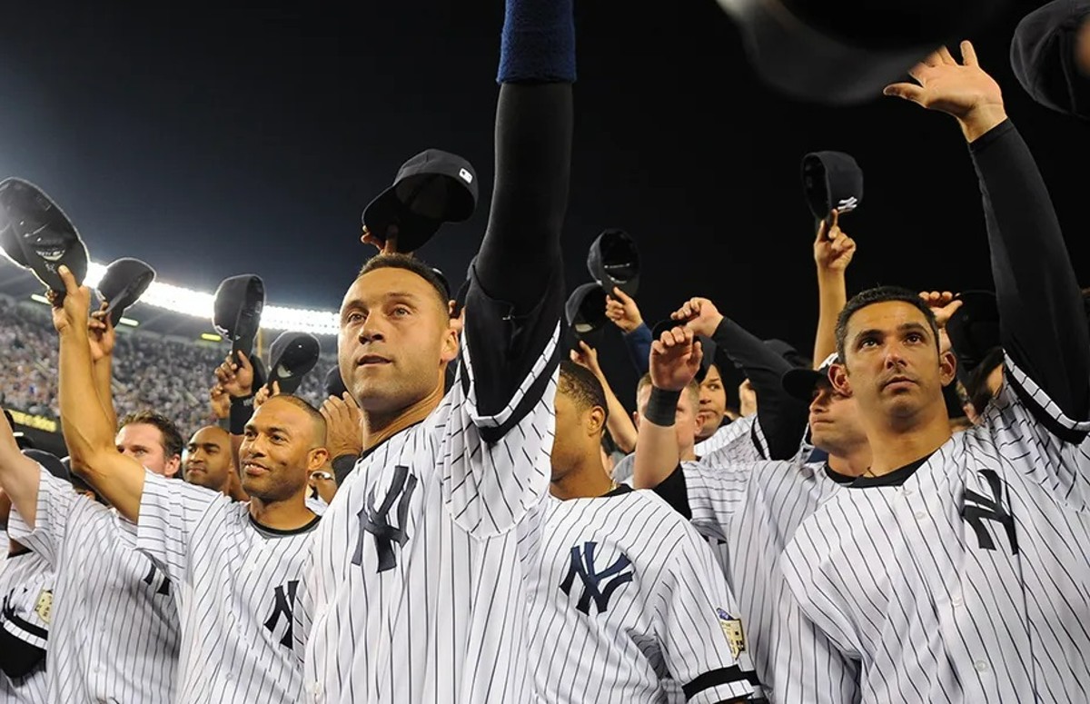 Derek Jeter-led 2008 New York Yankees are raising their caps following the last game ever at Old Yankee Stadium on Sept., 21, 2008.