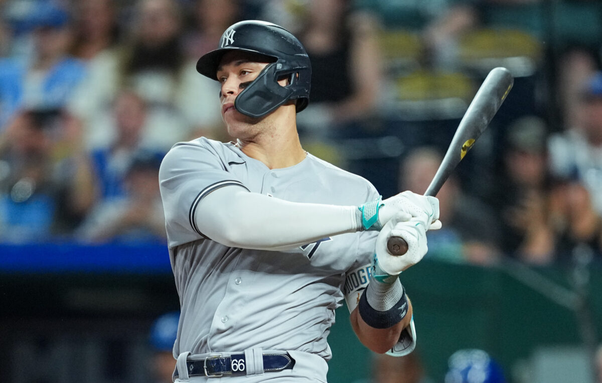 Yankees captain Aaron Judge hitting the ball for a home run during an away game in the 2023 season.