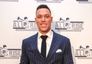 Baseball star Aaron Judge hits a charity home run at the 'All Star Evening,' generating $800,000 for youth empowerment initiatives.