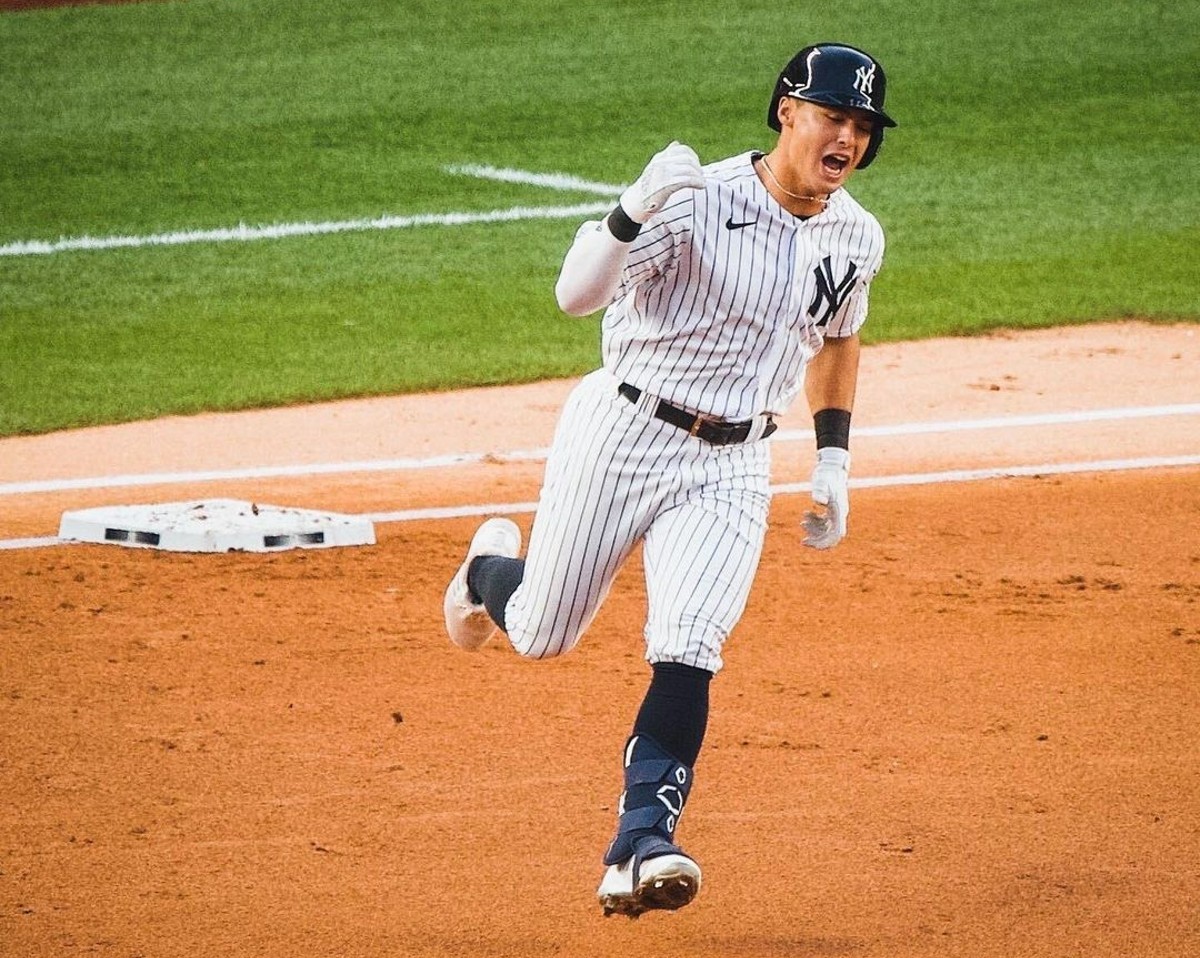 Anthony Volpe runs after hitting a home run at Yankee Stadium in August 2023.