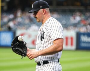 Yankees pitcher Carlos Rodon with manager Aaron Boone during the 2023 season.