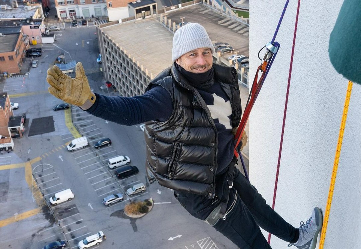 Yankees GM Brian Cashman is climbing a building at during a Stamford Downtown event called Heights & Lights on Sept 5, 2021 in Landmark Square Stamford CT.