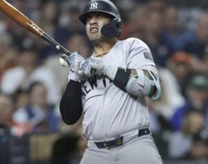 Yankees' Gleyber Torres is hit by a fastball in the game against the Astros in Houston on March 29, 2024.