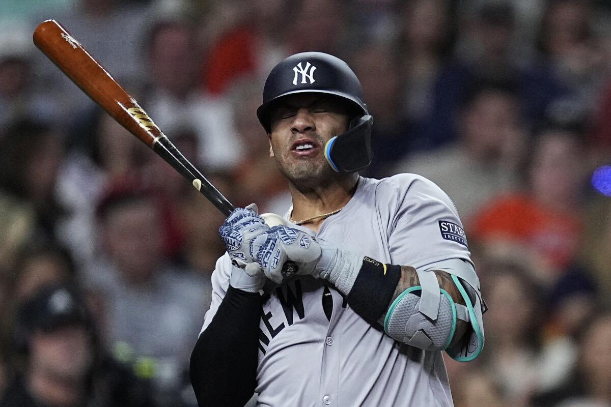 Yankees' Gleyber Torres is hit by a fastball in the game against the Astros in Houston on March 29, 2024.