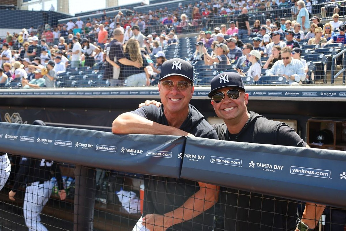 Yankees manager Aaron Boone and ex-Yankees star Tino Martinez at Steinbrenner Field, Tampa, in February 2024.