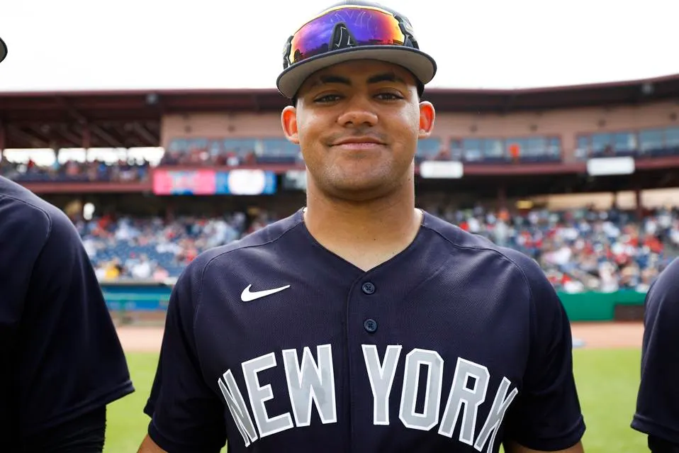 Jasson Domínguez #89 of the New York Yankees smiles before a spring training, in 2023.