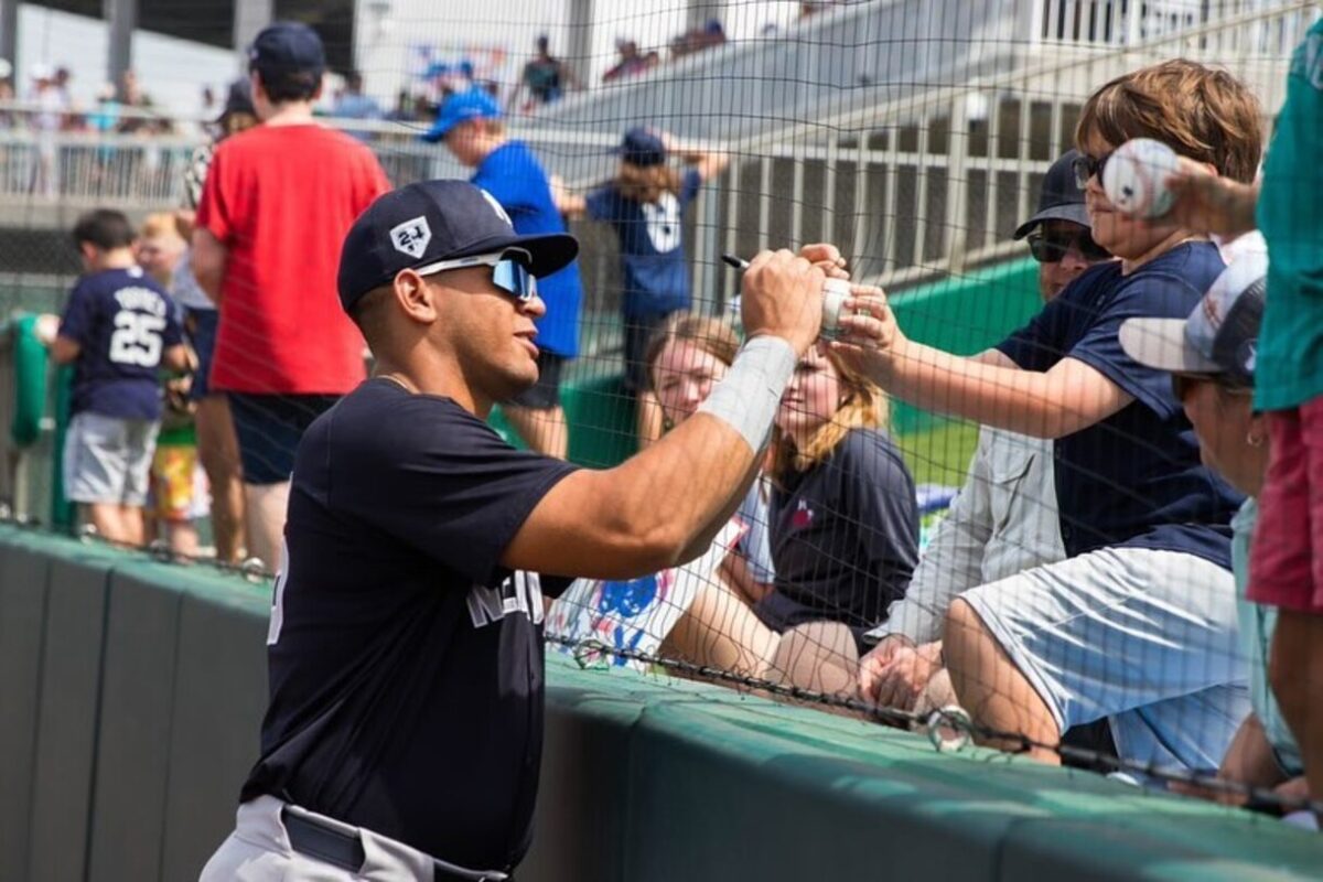 Yankees catching prospect Agustin Ramirez gives autographs to fans at Tampa, FL.