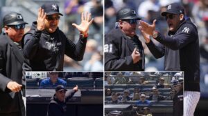 Aaron Boone protests his wrongful ejection and points to the fan who yelled at umpire Wendelstedt causing this at Yankee Stadium on April 22, 2024.