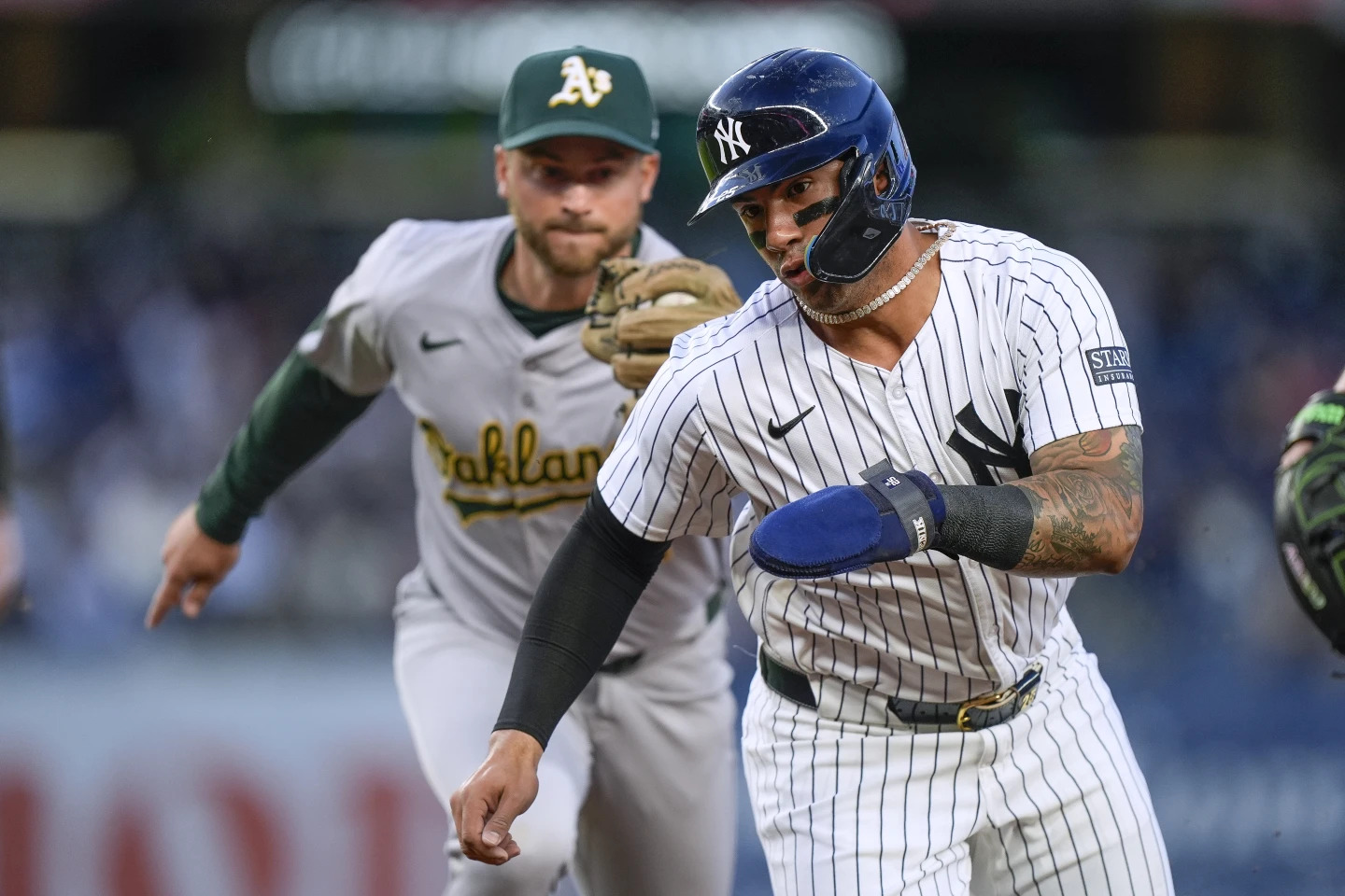 An Oakland player chases to tag Gleyber Torres as he tries to steal a base in the Yankees vs. A's game on April 25, 2024 at Yankee Stadium.