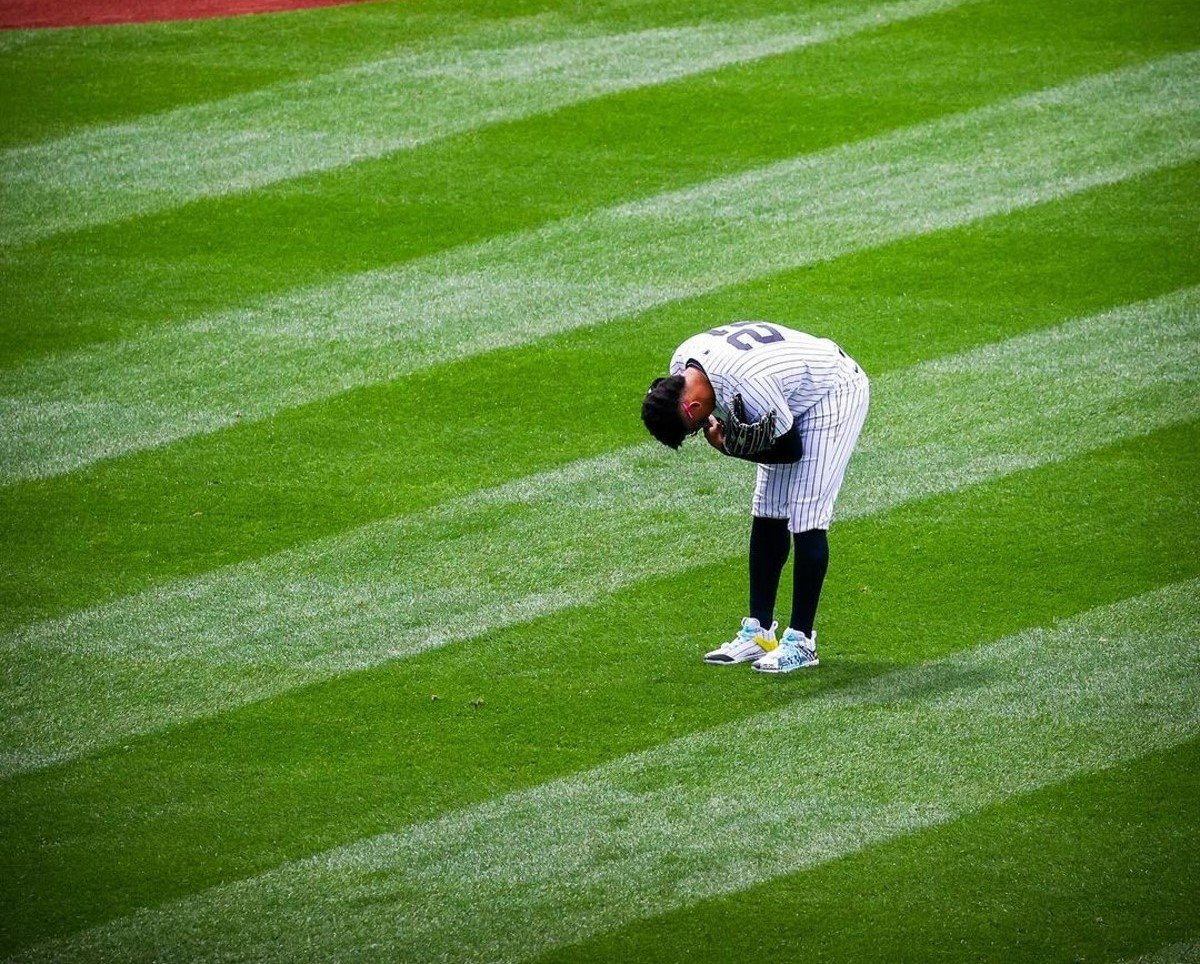 Juan Soto bows down to fans during his first Yankees game at Yankee Stadium on April 5, 2024.