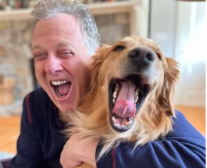 Long-time Yankees voice Michael Kay with his pet dog Butter in 2023.