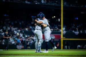 Austin Wells and Victor Gonzalez embrace each other after the Yankees beat the Diamondbacks in Chase Field on April 1, 2024.