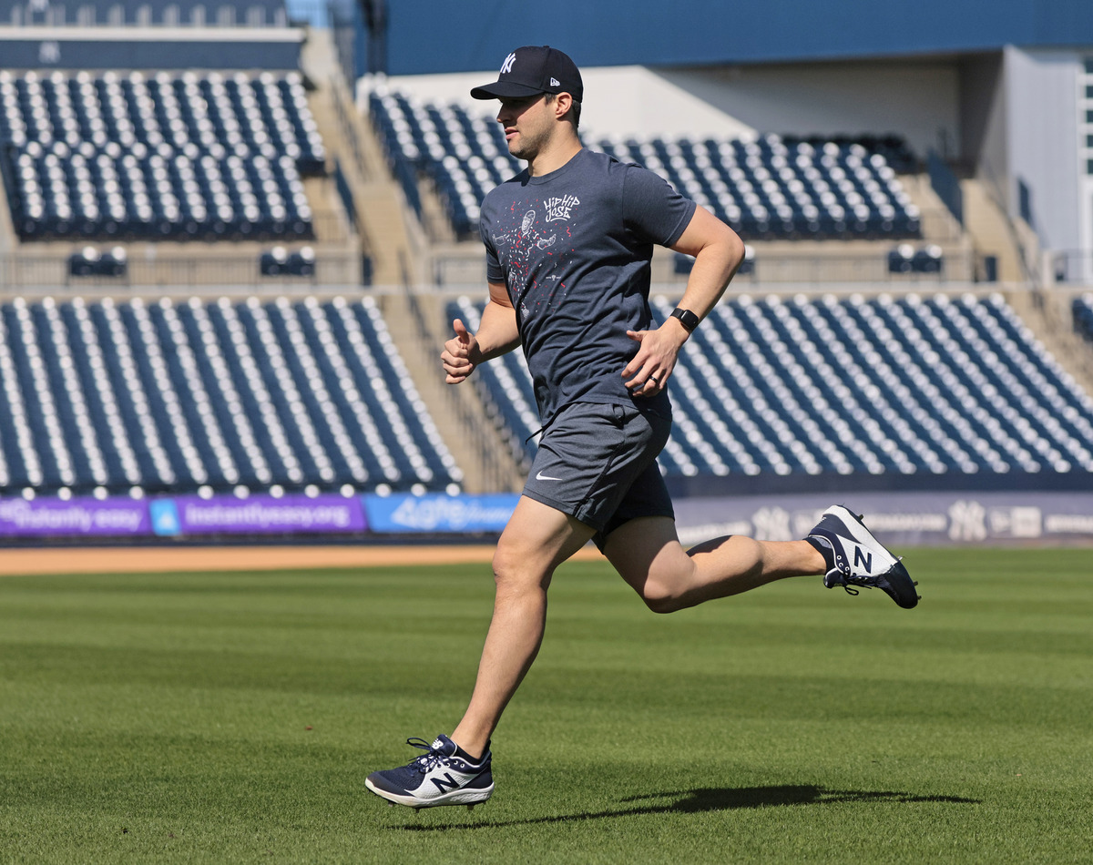 Tommy Kahnle running sprints on the field at Steinbrenner Field, the Yankees Spring training complex in Tampa Florida.