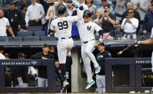 New York Yankees Aaron Judge (99) celebrates with Anthony Rizzo, right, after hitting a home run against the Chicago White Sox during the first inning of a baseball game, Friday, May 17, 2024, in New York.