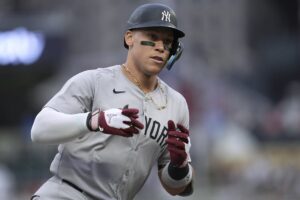 New York Yankees’ Aaron Judge runs the bases after hitting a solo home run against the Minnesota Twins during the first inning of a baseball game Wednesday, May 15, 2024, in Minneapolis.