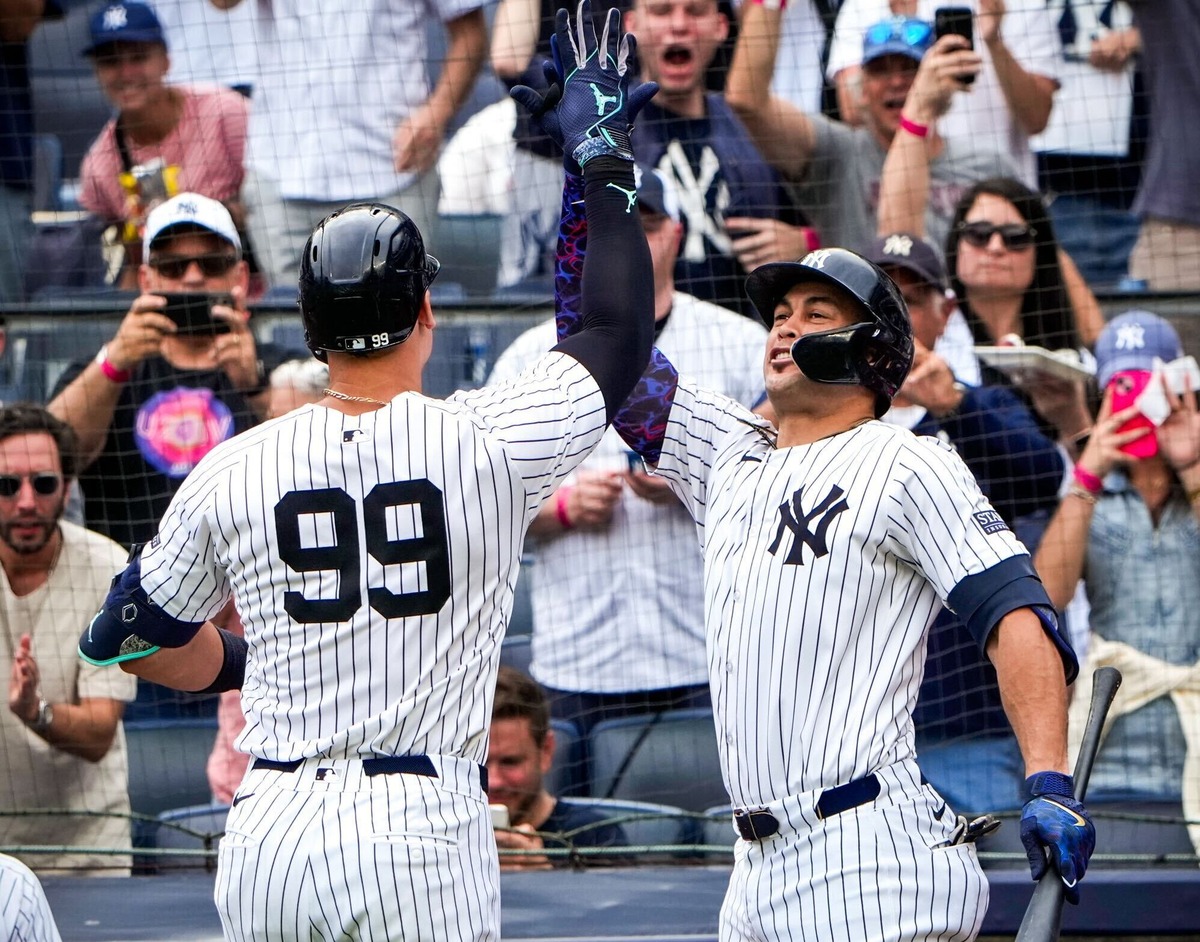 Yankees' Aaron Judge and Giancarlo Stanton celebrates after a homer against the Mariners at Yankee Stadium Thursday, May 23, 2024, in New York.